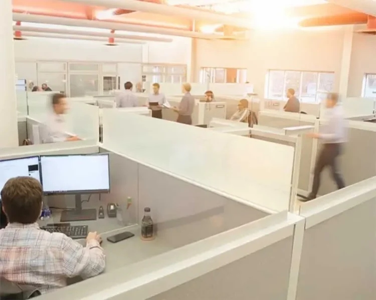 bustling office with people working and chatting