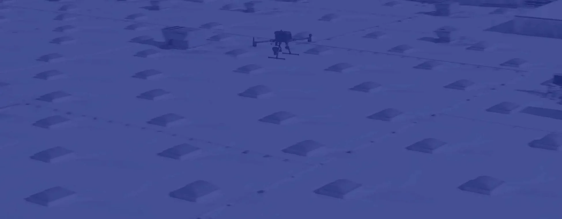 drone photographing a warehouse roof